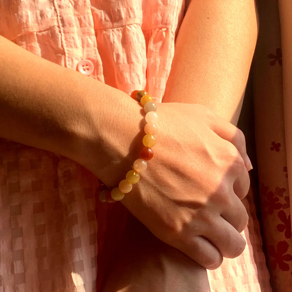 Golden Silk Jade bracelet worn on the wrist