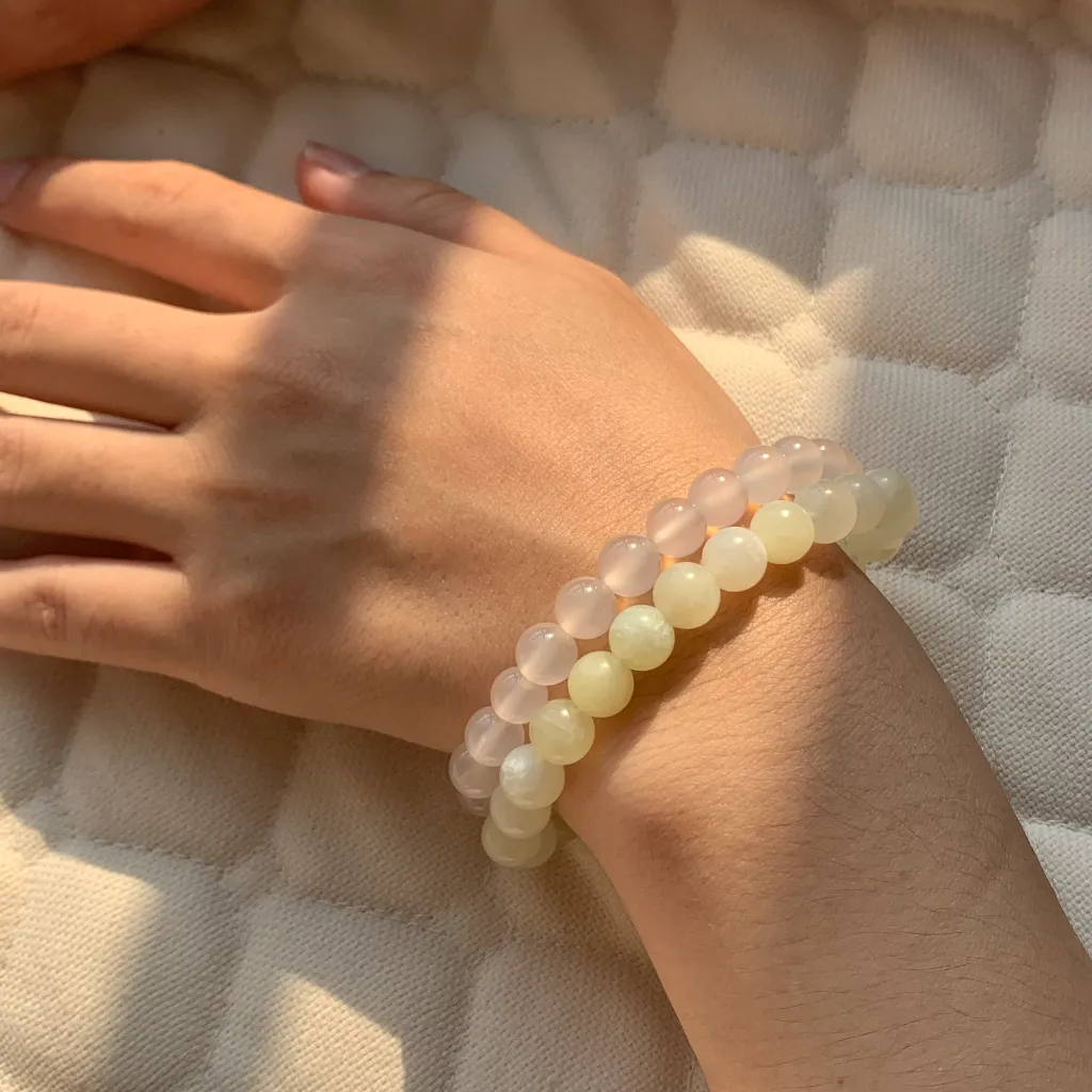 New Mountain Jade bracelet layered with White Agate Bracelet on the wrist — a stacked everyday styling