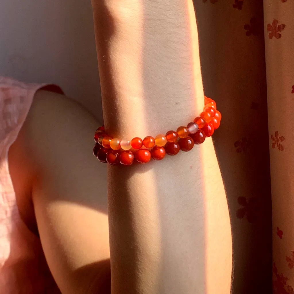 Red Agate Bracelet layered with Fire Element Bracelet on the wrist - a stacked everyday styling